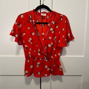 Red floral top, short length but not quite crop, flutter sleeve faux wrap